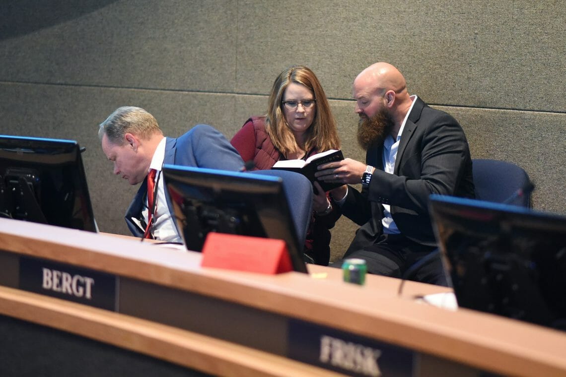 Municipal Manager Amy Demboski and Adam Trombley, the mayor's Director of the ECD, consult Robert's Rules